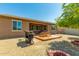 Great backyard space featuring a built-in grill, deck, and gravel area for backyard entertainment at 5218 W Lydia Ln, Laveen, AZ 85339