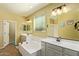 This bathroom boasts double sinks, a soaking tub, and a separate shower at 5218 W Lydia Ln, Laveen, AZ 85339