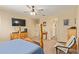 A nicely furnished bedroom has soft carpet, a ceiling fan, and plenty of space at 5218 W Lydia Ln, Laveen, AZ 85339