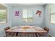 Bright dining room with a window, table with seating for six. Perfect space for Gathering meals and gatherings at 5218 W Lydia Ln, Laveen, AZ 85339