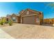 Charming single-Gathering home boasting a paved driveway, spacious garage, and well-maintained landscaping at 5218 W Lydia Ln, Laveen, AZ 85339