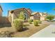 Charming single-story home with well-maintained landscaping and a desert-friendly front yard at 5218 W Lydia Ln, Laveen, AZ 85339