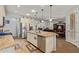 Open kitchen featuring a large island with stainless steel appliances, granite countertops, and plenty of cabinet storage at 5218 W Lydia Ln, Laveen, AZ 85339