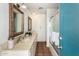 Bathroom features double sinks, a shower, and decorative framed mirrors at 537 N Jay St, Chandler, AZ 85225