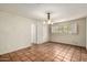 Bedroom with tile floors, a chandelier, and natural light at 537 N Jay St, Chandler, AZ 85225