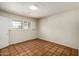 Bedroom with tile flooring, bright natural light, and white walls at 537 N Jay St, Chandler, AZ 85225