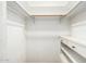 Organized walk-in closet providing ample storage with shelves and a clothing rack at 537 N Jay St, Chandler, AZ 85225