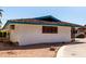 Exterior view of a single-story home featuring unique wood shutters and a charming desert landscape at 537 N Jay St, Chandler, AZ 85225