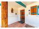 Charming front door with rustic wood finish and vibrant turquoise accents, welcoming guests to this cozy home at 537 N Jay St, Chandler, AZ 85225