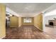 Large living area with tile floors, a fireplace, and ample natural light, perfect for entertaining at 537 N Jay St, Chandler, AZ 85225