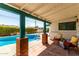 Relaxing outdoor patio with a pool, comfortable seating and covered area at 537 N Jay St, Chandler, AZ 85225