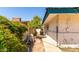 Narrow side yard with utilities and greenery, leading to a view of a neighboring house at 537 N Jay St, Chandler, AZ 85225