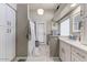 Bright bathroom features single sink vanity, bathtub, and recessed lighting at 5674 W North Ln, Glendale, AZ 85302