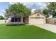 Charming single-story home with a well-manicured lawn and two car garage in a desirable community at 5674 W North Ln, Glendale, AZ 85302