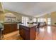 Spacious kitchen with granite countertops, center island, and open layout leading to living area at 5674 W North Ln, Glendale, AZ 85302
