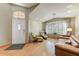 Inviting living room with plenty of natural light from the large windows and hardwood floors throughout at 5674 W North Ln, Glendale, AZ 85302
