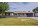 Charming single-story home features a well-manicured lawn and a two car garage at 5929 S Lakeshore Dr, Tempe, AZ 85283