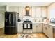 Modern kitchen features stainless steel appliances and light-colored cabinets at 5929 S Lakeshore Dr, Tempe, AZ 85283