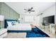 Bright bedroom featuring stylish decor, soft carpet and a modern ceiling fan at 5929 S Lakeshore Dr, Tempe, AZ 85283