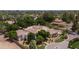 Expansive desert property featuring mature trees, private driveway and lush landscaping at 6243 E Camelback Rd, Scottsdale, AZ 85251