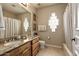 Functional bathroom featuring granite countertops, a tub with a shower, and neutral tiling at 6243 E Camelback Rd, Scottsdale, AZ 85251