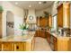 Well-equipped kitchen with stainless steel appliances, granite countertops, and custom cabinetry at 6243 E Camelback Rd, Scottsdale, AZ 85251