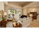 Elegant living room with neutral tones, comfortable seating, and a grand piano at 6243 E Camelback Rd, Scottsdale, AZ 85251