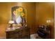 Elegant wet bar area featuring wine storage, display shelving, and a decorative mural at 6243 E Camelback Rd, Scottsdale, AZ 85251