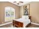 Cozy bedroom features a wooden sleigh bed, plantation shutters, and hardwood floors at 700 N Dobson Rd # 54, Chandler, AZ 85224