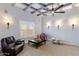 Cozy room with coffered ceiling, a leather recliner, fun toys, and ample space for play at 700 N Dobson Rd # 54, Chandler, AZ 85224