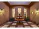 This landscaped courtyard features a fountain, ambient lighting, and three large windows at 700 N Dobson Rd # 54, Chandler, AZ 85224