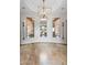Bright, open foyer with decorative lighting and views into the dining and living areas at 700 N Dobson Rd # 54, Chandler, AZ 85224