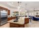 Spacious kitchen featuring an island, granite counters, stainless steel appliances, and an open concept at 700 N Dobson Rd # 54, Chandler, AZ 85224