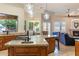 This kitchen island offers bar seating, granite countertops, and an open view to the living room at 700 N Dobson Rd # 54, Chandler, AZ 85224