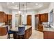 This gourmet kitchen features custom cabinetry, an island with seating, and stainless steel appliances at 700 N Dobson Rd # 54, Chandler, AZ 85224