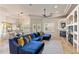 Bright, spacious living room boasts elegant fireplace, travertine flooring, and adjacent formal dining space at 700 N Dobson Rd # 54, Chandler, AZ 85224