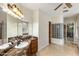 This main bathroom features dual sinks and marble counters and flooring at 700 N Dobson Rd # 54, Chandler, AZ 85224