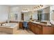 This main bathroom features a vanity, jacuzzi tub, and marble counters and flooring at 700 N Dobson Rd # 54, Chandler, AZ 85224