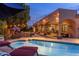 Relaxing outdoor pool with lounge chairs, a built-in grill, and covered patio provides the perfect backyard retreat at 700 N Dobson Rd # 54, Chandler, AZ 85224