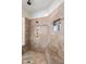 Tiled shower stall featuring a built-in bench and shower head at 700 N Dobson Rd # 54, Chandler, AZ 85224