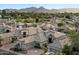 Stunning aerial view of the neighborhood showcasing tile roofs and desert landscaping with mountain backdrop at 7705 E Doubletree Ranch Rd # 51, Scottsdale, AZ 85258