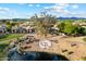 Scenic aerial view of golf course community with lake and lush landscaping, mountains in the distance at 7705 E Doubletree Ranch Rd # 51, Scottsdale, AZ 85258