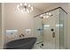 Contemporary bathroom with a sleek tub, stylish shower with glass door and unique lighting at 7705 E Doubletree Ranch Rd # 51, Scottsdale, AZ 85258