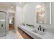 Modern bathroom with dual sinks, marble countertops, and a sleek shower with glass door at 7705 E Doubletree Ranch Rd # 51, Scottsdale, AZ 85258