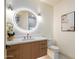 Modern bathroom boasting an illuminated mirror, wood vanity, and refined details at 7705 E Doubletree Ranch Rd # 51, Scottsdale, AZ 85258