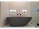 Modern bathroom featuring a luxurious soaking tub and sleek, minimalist design at 7705 E Doubletree Ranch Rd # 51, Scottsdale, AZ 85258