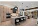 A modern kitchen boasts a large island with seating, ample storage, and sleek appliances with an open design at 7705 E Doubletree Ranch Rd # 51, Scottsdale, AZ 85258