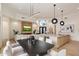 Open-concept living space featuring a fireplace, dining area, and kitchen with modern lighting and decor at 7705 E Doubletree Ranch Rd # 51, Scottsdale, AZ 85258