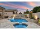 Beautiful backyard pool featuring a spa, elegant water features, desert landscaping, and vibrant sunset views at 7705 E Doubletree Ranch Rd # 51, Scottsdale, AZ 85258
