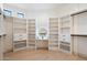 Spacious walk-in closet with custom shelving, drawers, and ample storage space at 7705 E Doubletree Ranch Rd # 51, Scottsdale, AZ 85258